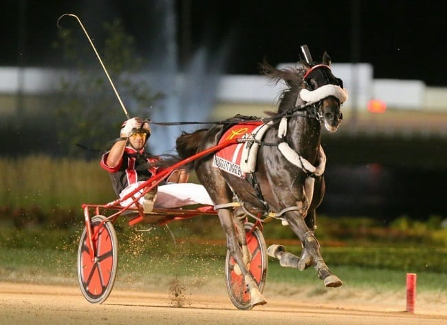 Wiggle It Jiggleit (Montrell Teague) snuck up the inside to defeat Always B Miki in the Dan Patch Stakes Friday at Hoosier Park | Dean Gillette