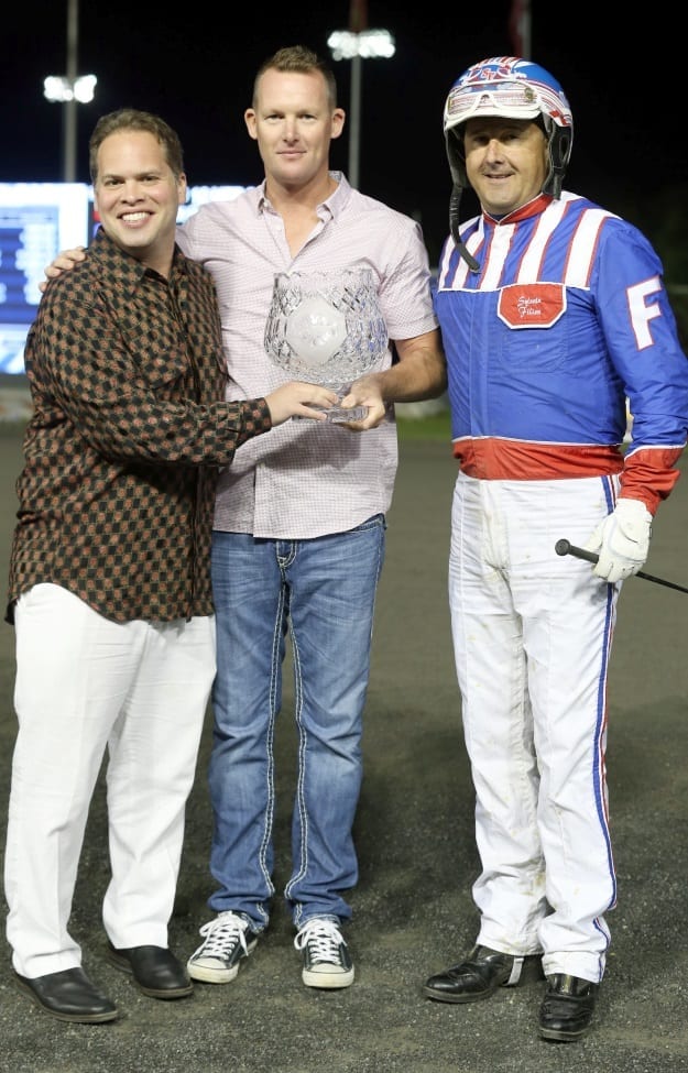Part-owner Michael Snyder (left) and trainer Tony O’Sullivan (middle) each reported they were “coming out of their skins” after Sylvain Filion (right) drove Beyond Delight to victory in the Metro Pace. | New Image Media
