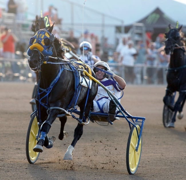 Betting Line and David Miller winning the deciding heat of the 71st Little Brown Jug with a 1:49 world record. | Dave Landry
