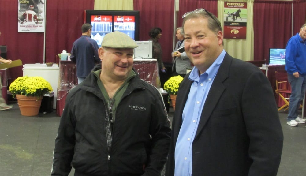 David Reid's Preferred Equine Marketing led all consignors with $13,318,001 in sales for 435 horses sold. Reid (right) is shown with Mike Kimelman, Jr. | Dave Briggs