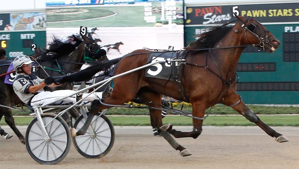 Eash and his homebred Rustle's Chip winning the Indiana Sires Stakes final in 2013 at Hoosier Park | Linscott Photography