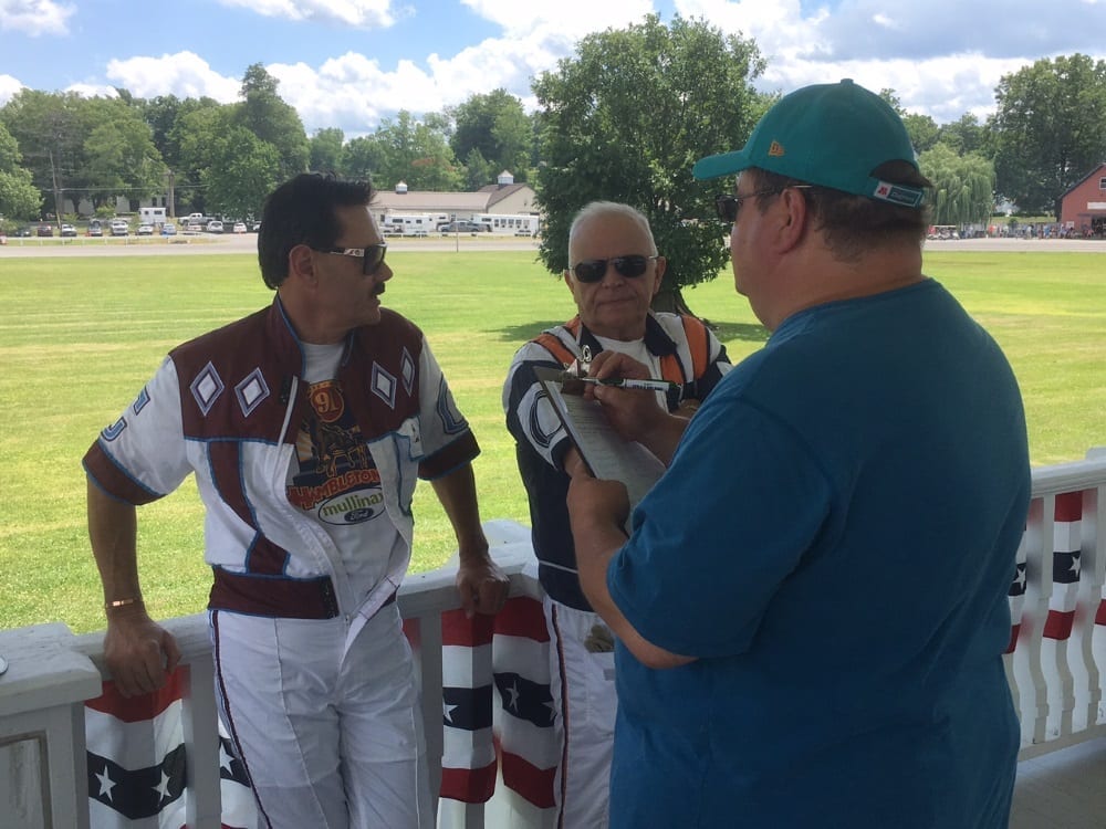 John Campbell (left) and Bill O'Donnell holding court at Goshen Historic Track on Hall of Fame Day (July 2) with writer Dave Little | Heather Wilder