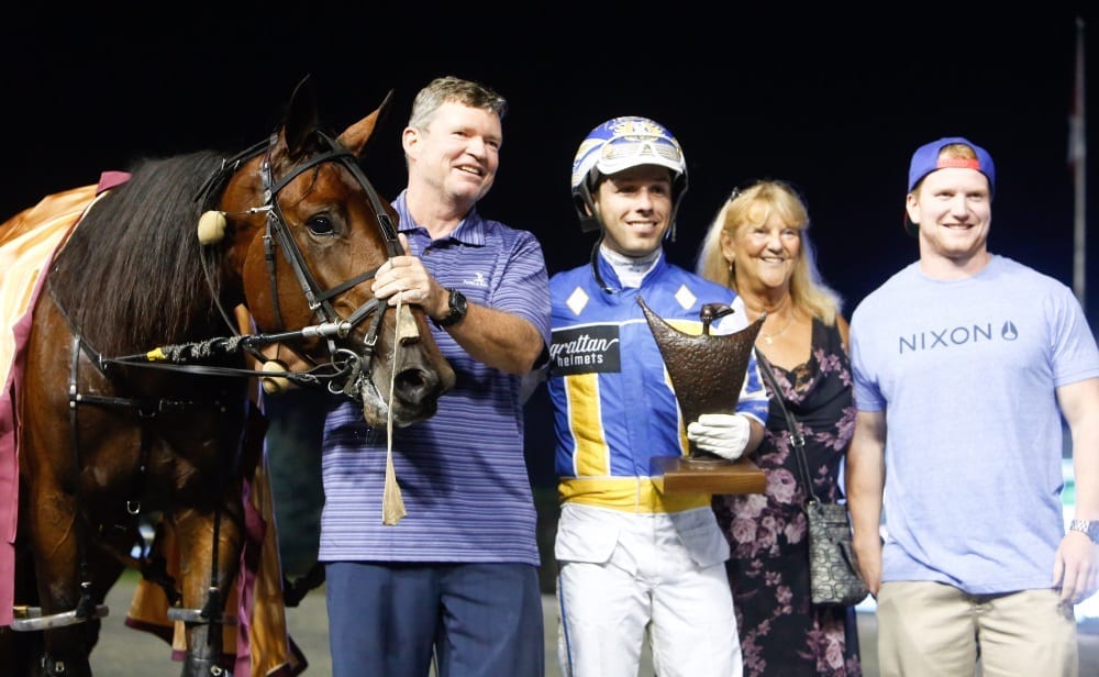 Though lone owner Bill Donovan was on a cruise ship in the Atlantic Ocean, Youaremycandygirl's other connections were all smiles in the winner's circle | Dave Landry