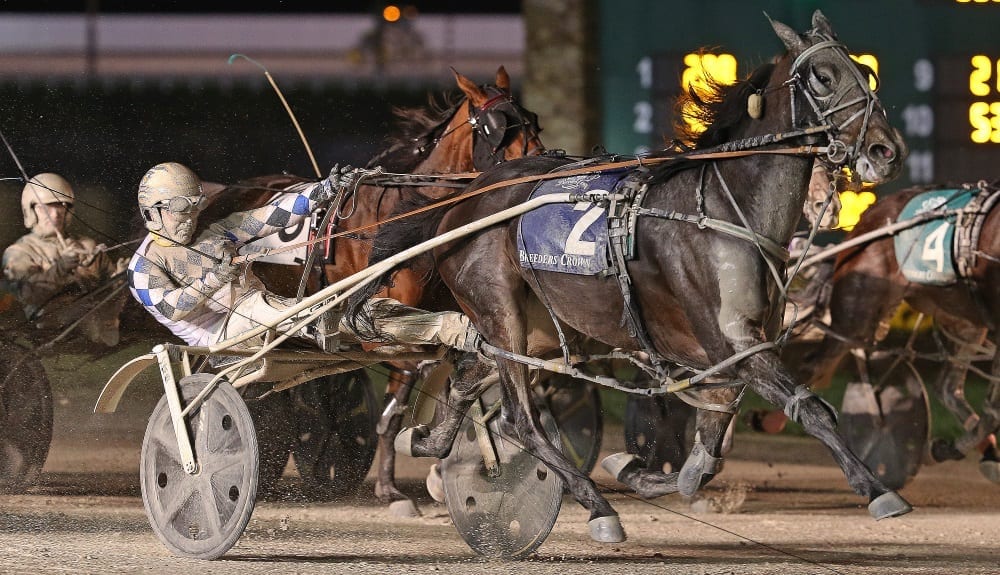 Mark MacDonald, wearing Diamond Creek colors, orchestrated a one-and-a-quarter-length victory in 1:52.1 to post his third Breeders Crown triumph | Claus Andersen