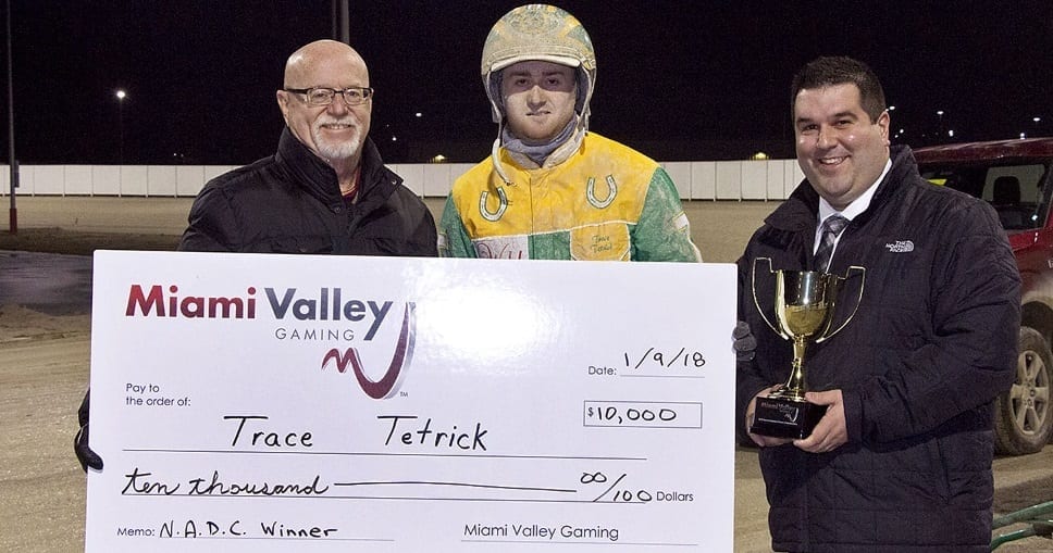 Miami Valley race secretary Gregg Keidel (left) and racing operations manager Myles Linderman present Trace Tetrick with his $10,000 winner's check | Brad Conrad
