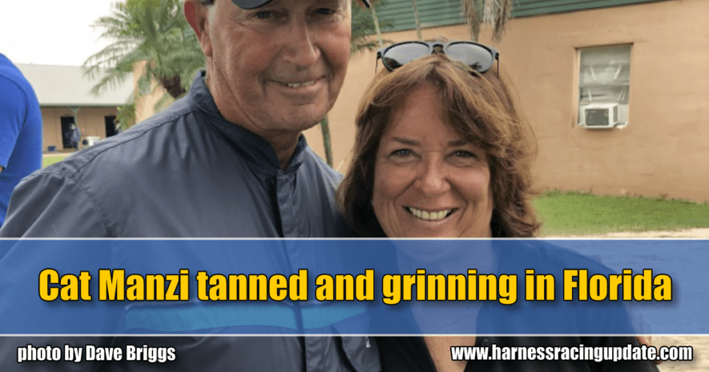 Cat Manzi tanned and grinning in Florida